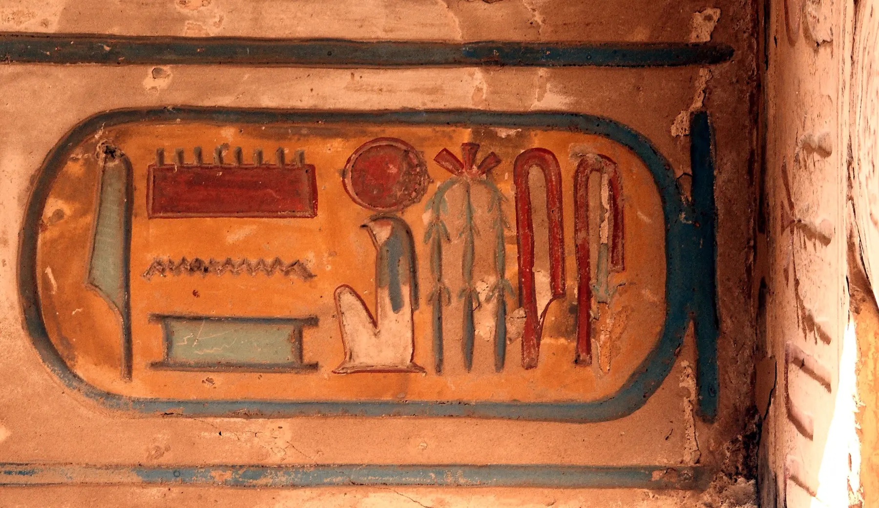 Columns in the Great Hypostyle Hall at Karnak Temple, carved with ancient Egyptian writing.